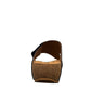 Taos Loop navy leather toe-post sandal with adjustable hook-and-loop strap and cushioned cork foot bed. Photo of back view.