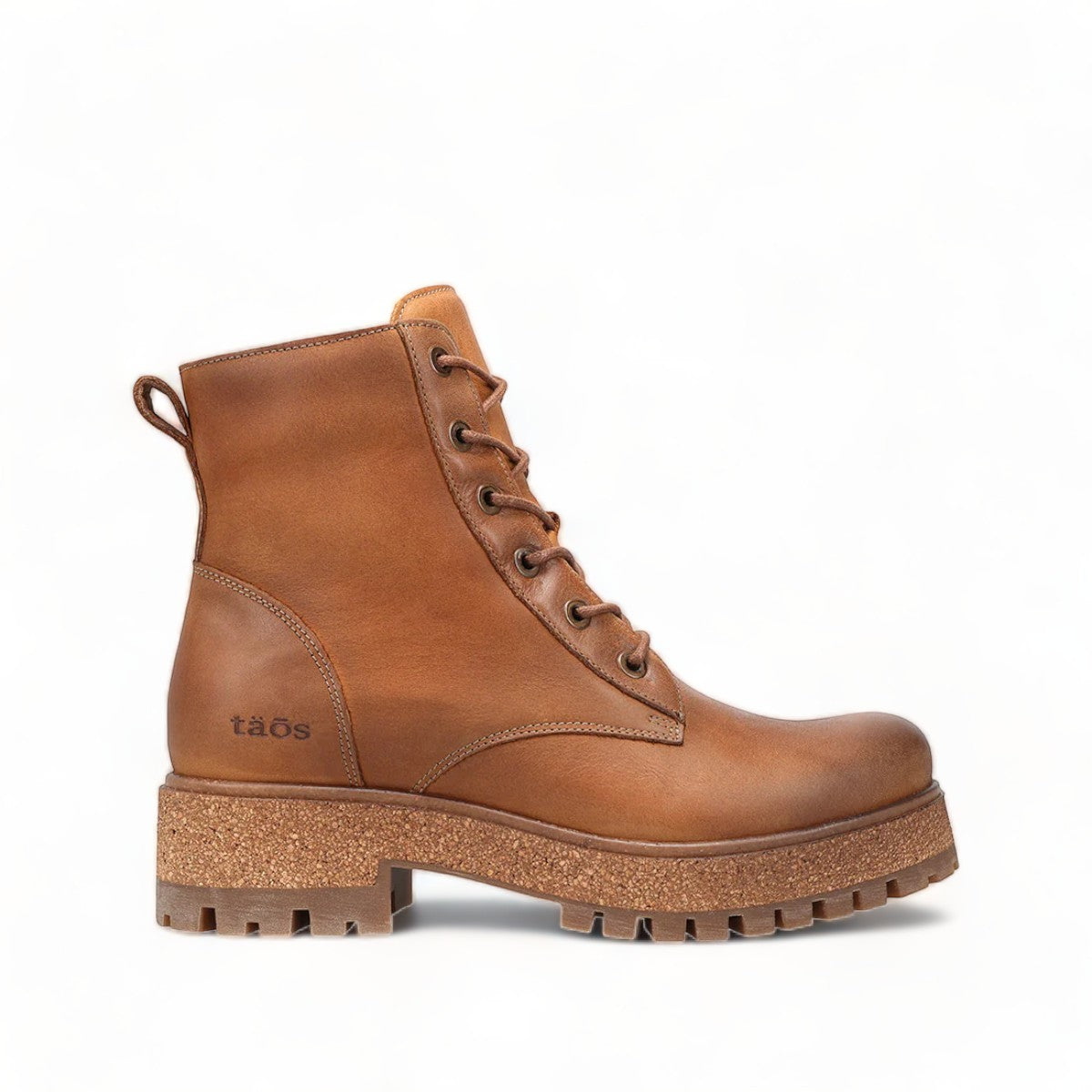 Taos Main Street tan leather lace-up platform boot with a cork midsole and rugged rubber lug outsole. Photo of left side view.