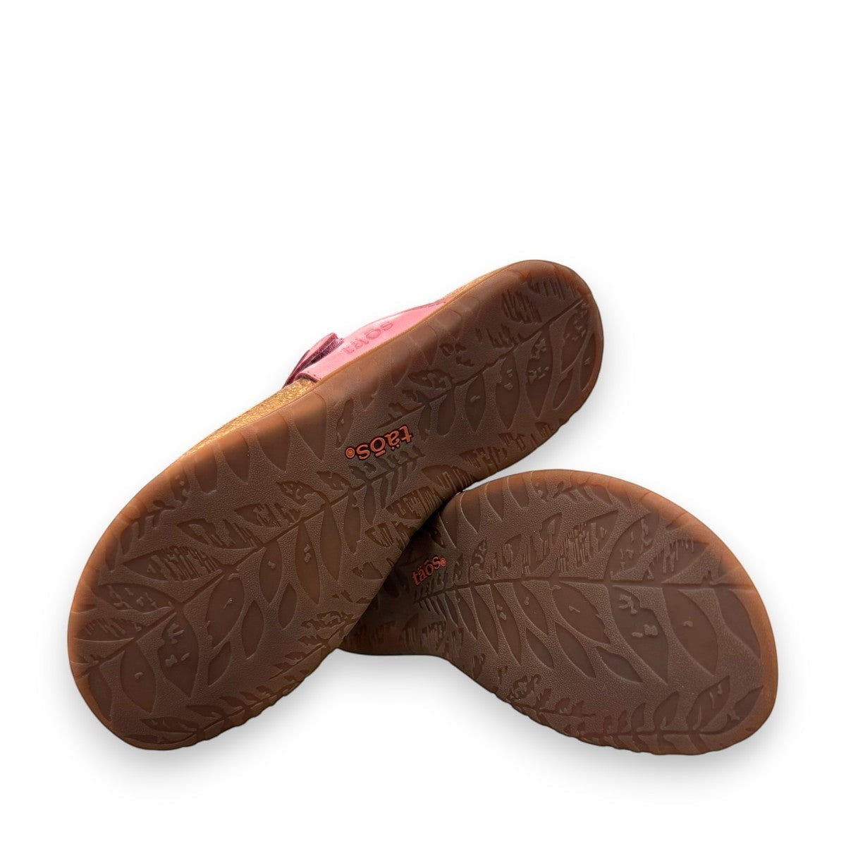 Taos Perfect thong sandal in rustic pink leather with adjustable hook-and-loop strap and cork midsole. Photo of bottom view.