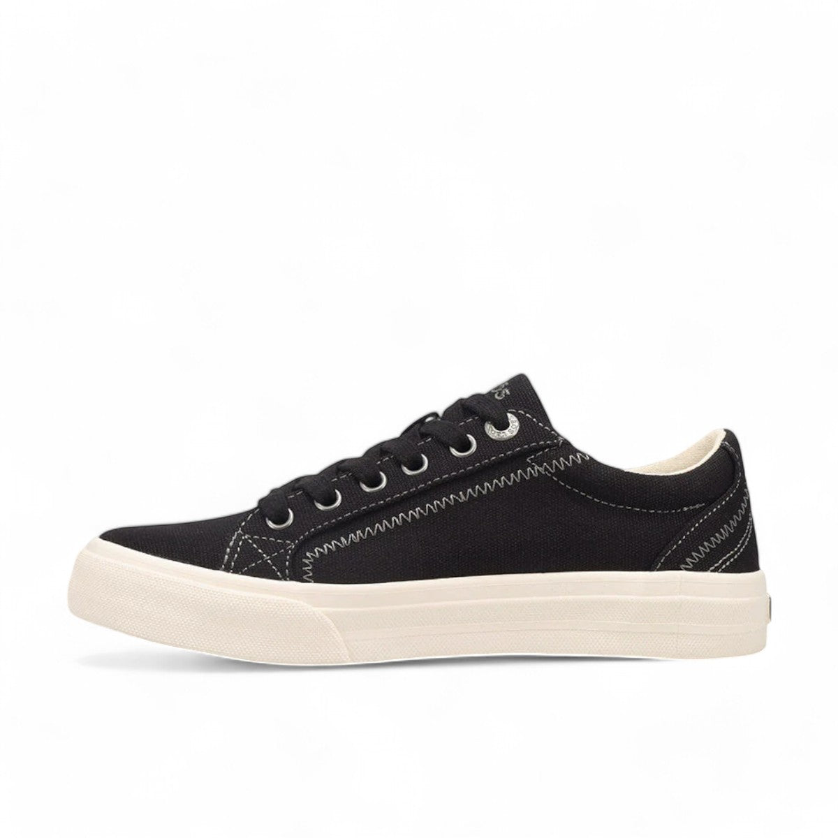 Taos Plim Soul black canvas sneaker with white rubber platform sole and decorative stitching. Photo of inside side view.