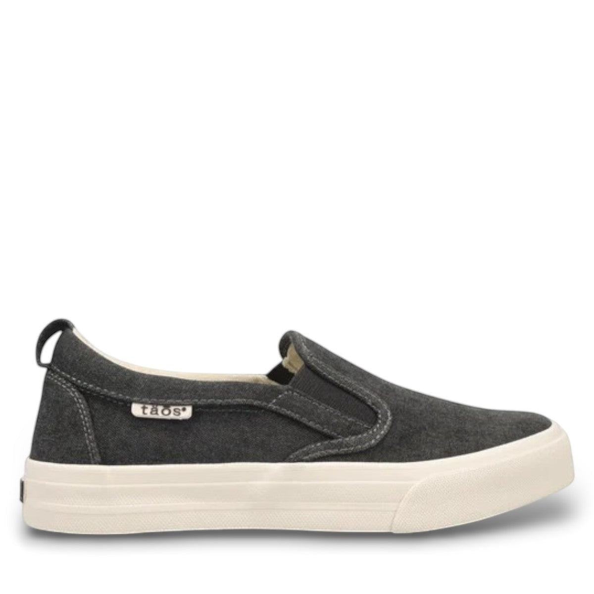 Taos Rubber Soul charcoal wash canvas slip-on sneaker with white platform rubber sole. Photo of outside side view.