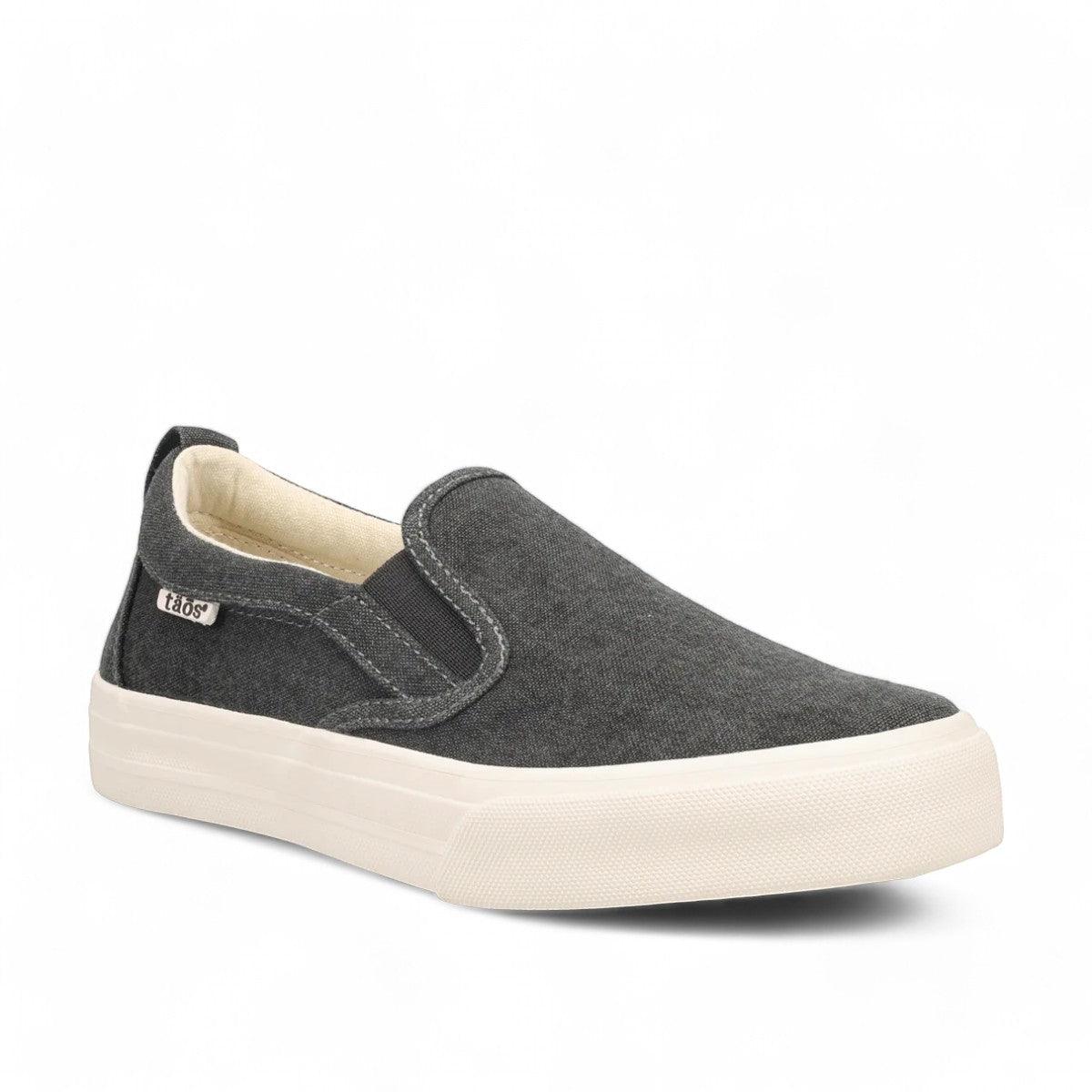 Taos Rubber Soul charcoal wash canvas slip-on sneaker with white platform rubber sole. Photo of front view.