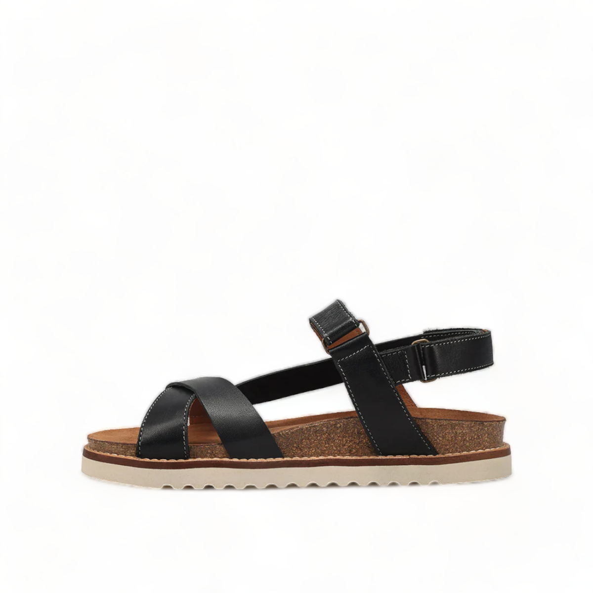 Taos Sideways black leather adjustable sandal with cork midsole and off-white EVA outsole. Photo of left side view.