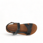 Taos Sideways black leather adjustable sandal with cork midsole and off-white EVA outsole. Photo of upper view.