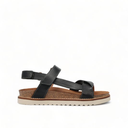 Taos Sideways black leather adjustable sandal with cork midsole and off-white EVA outsole. Photo of right side view.