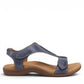 Taos The Show dark blue leather sandal with adjustable hook and loop straps and contrast stitching. Photo of side view.