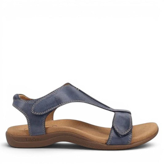 Taos The Show dark blue leather sandal with adjustable hook and loop straps and contrast stitching. Photo of side view.