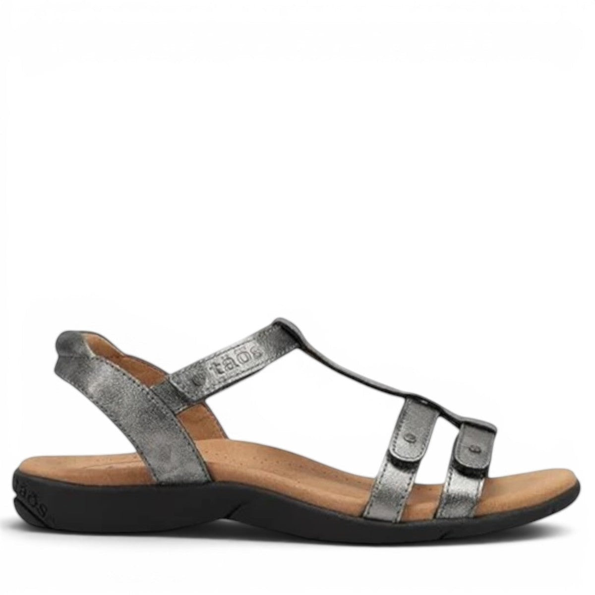 Taos Trophy 2 pewter leather strappy sandal with adjustable hook and loop straps and cushioned foot bed. Photo of outside side view.