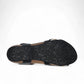 Taos Trulie L.E. black multi woven adjustable sandal with cork foot bed and arch support. Photo of bottom view.