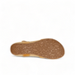 Taos Universe camel leather sandal with Z-strap design, cork footbed, and medallion embellishments. Photo of bottom view.