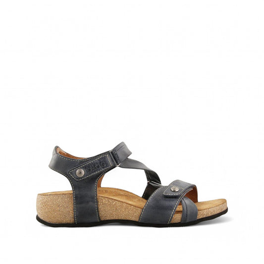 Taos Universe navy leather sandals with Z-strap design, cork foot bed, and medallion embellishments. Photo of side view.