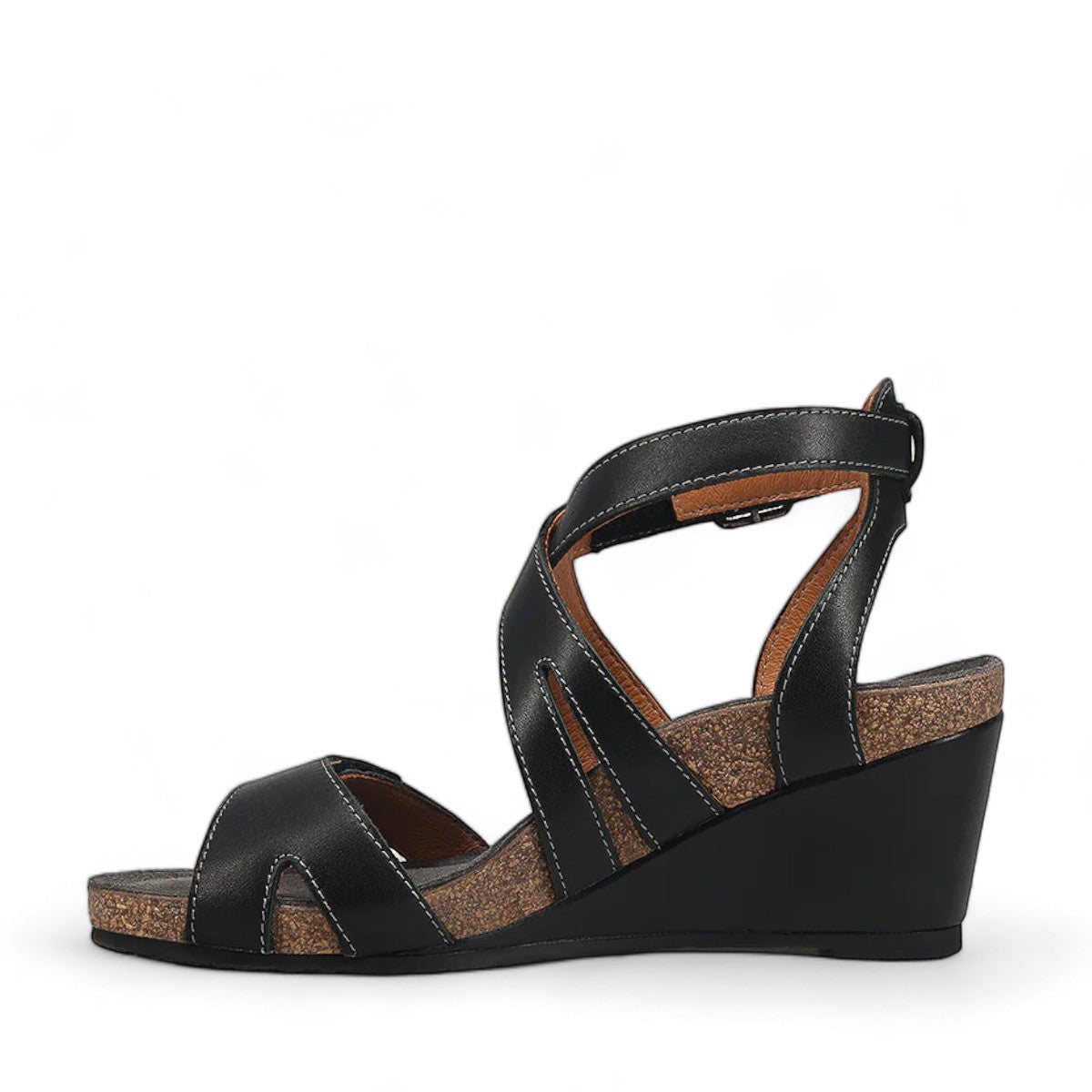 Taos Xcellent black leather wedge sandals with crisscross straps and cork foot bed. Photo of inside side view.