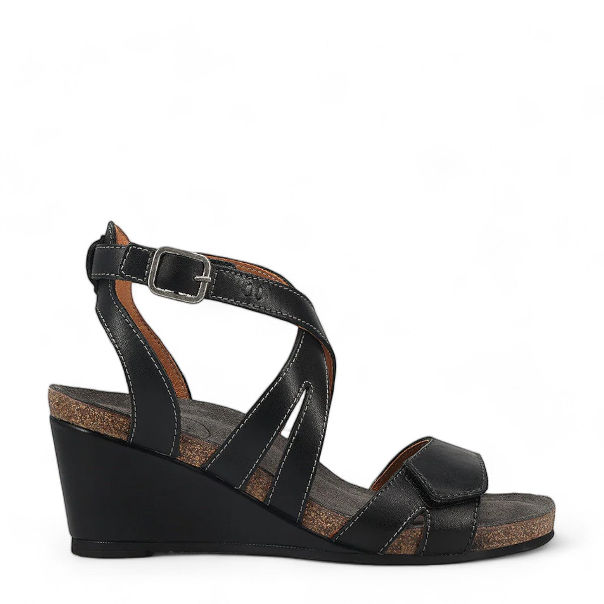 Taos Xcellent black leather wedge sandals with crisscross straps and cork foot bed. Photo of outside side view.