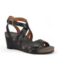 Taos Xcellent black leather wedge sandals with crisscross straps and cork foot bed. Photo of front view.