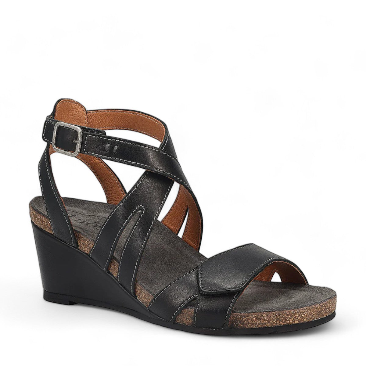 Taos Xcellent black leather wedge sandals with crisscross straps and cork foot bed. Photo of front view.