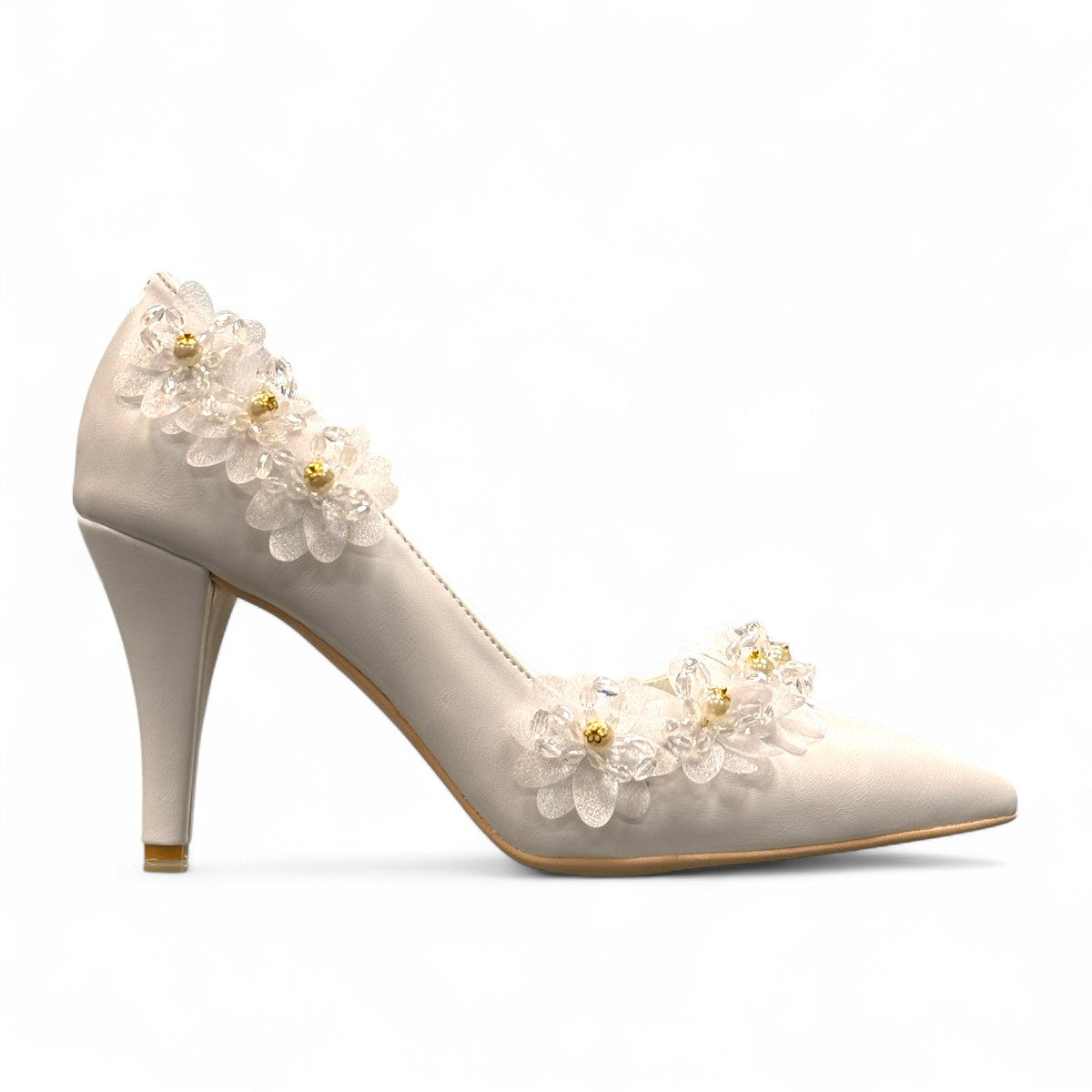 Ticky white pointed-toe high heel pump featuring delicate floral embellishments with crystal accents. Photo of right side view.