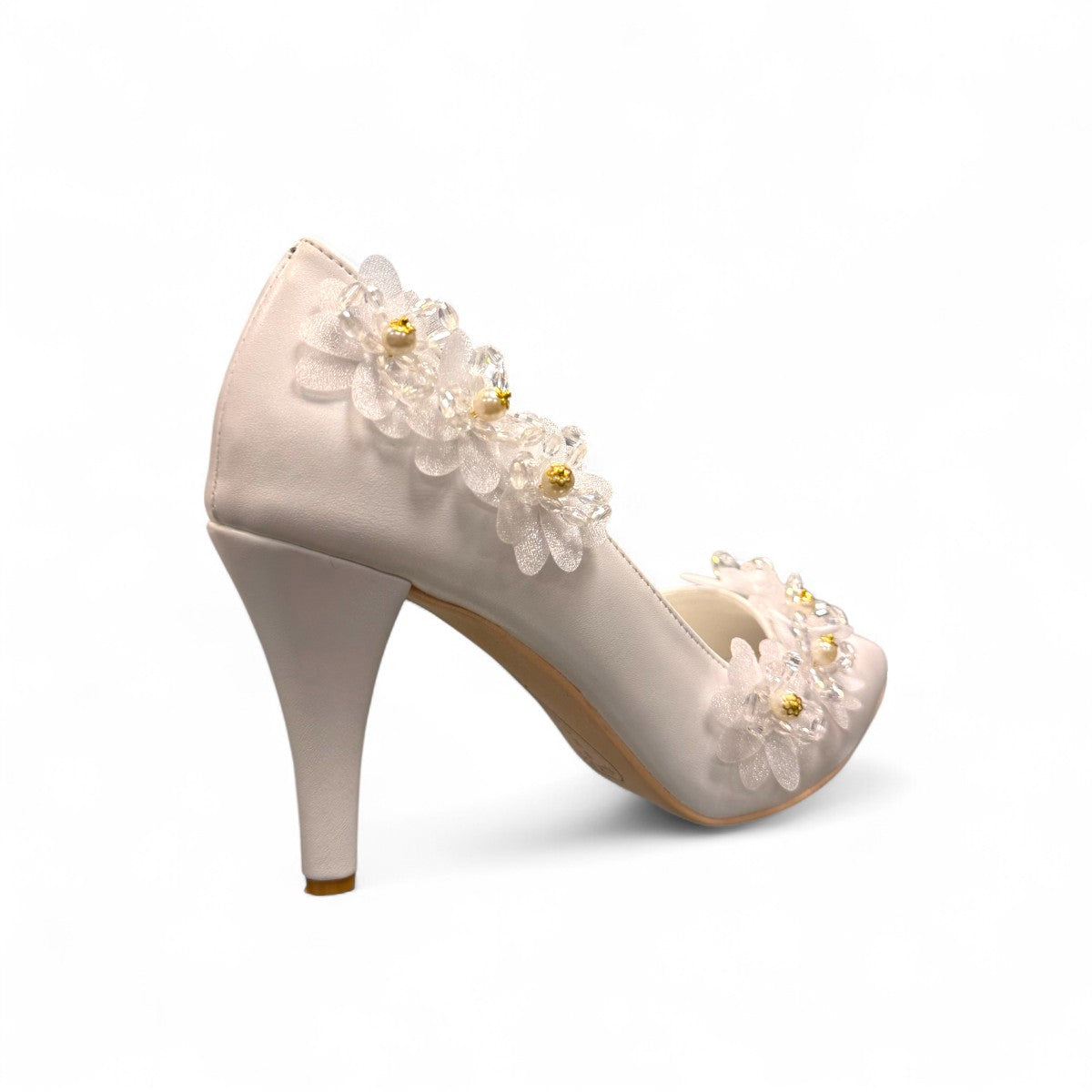 Ticky white pointed-toe high heel pump featuring delicate floral embellishments with crystal accents. Photo of back side view.