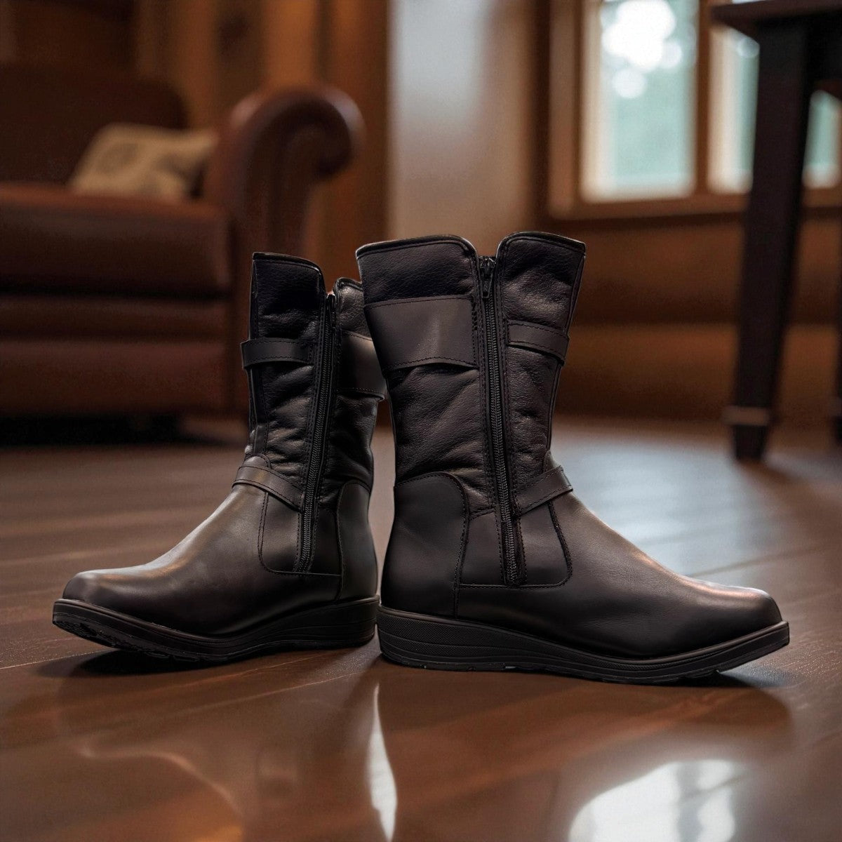 Toe Warmers Rebecca black mid-calf boots featuring dual silver buckle straps and a comfortable wedge sole. Photo of front side view 2.