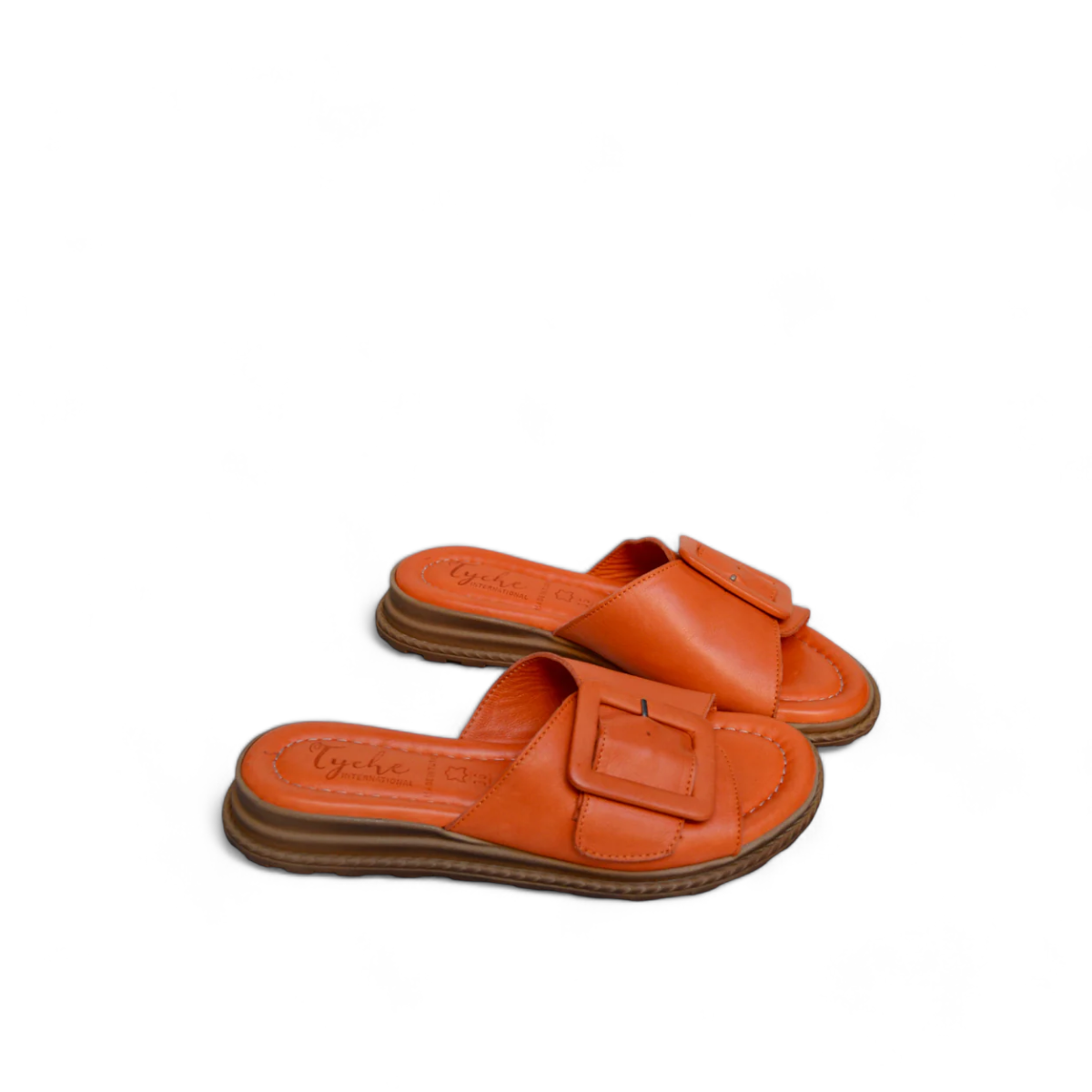 Tyche Monroe orange leather slide sandals with adjustable buckle and comfortable cushioned insole. Photo of side views.