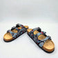 Viking Banff three-strap sandal in black paisley print with cork midsole and adjustable buckles.
photo of the front side
