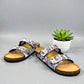 Viking Chatham two-strap sandal with a blue and brown bubble print, cork midsole, and buckle closures.
photo of the front