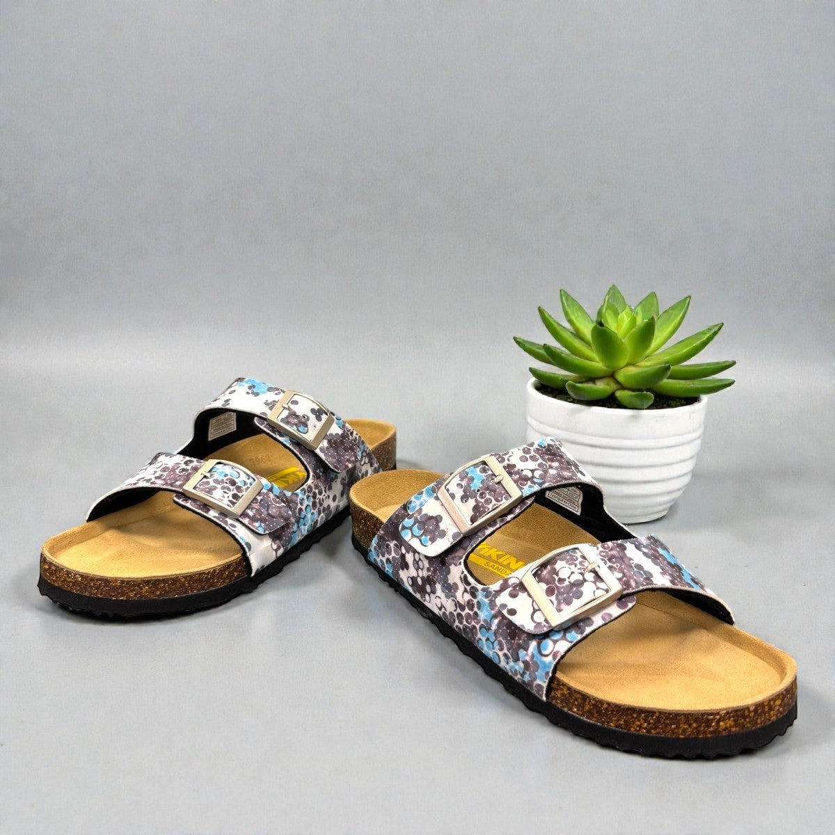Viking Chatham two-strap sandal with a blue and brown bubble print, cork midsole, and buckle closures.
photo of the front