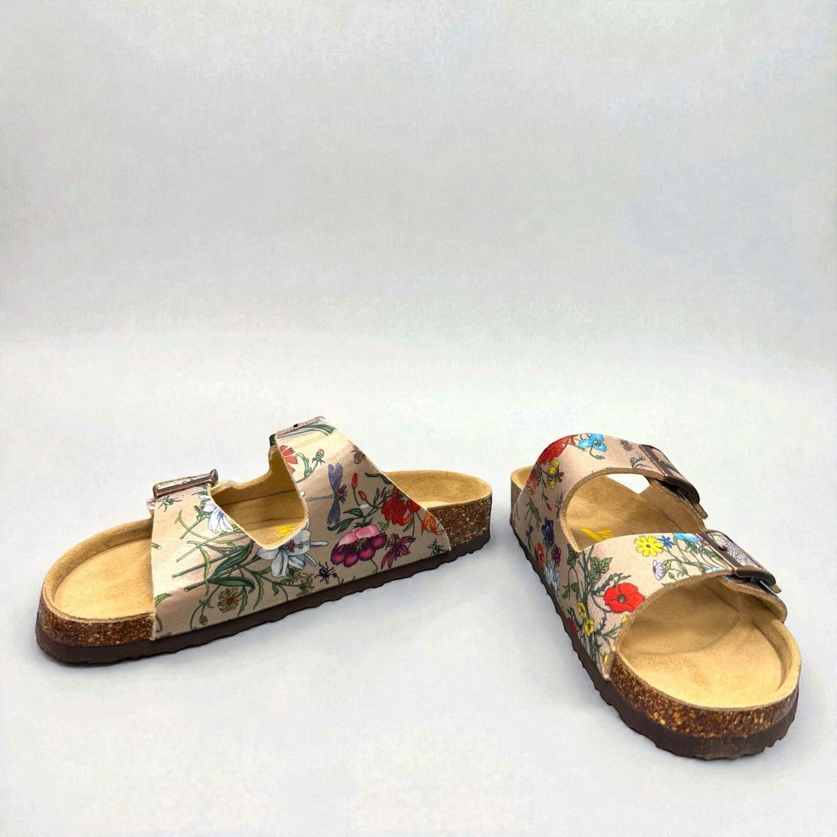 Viking Chatham toe-loop sandal with a beige floral wild garden print, cork midsole, and adjustable buckles.
photo of the front side