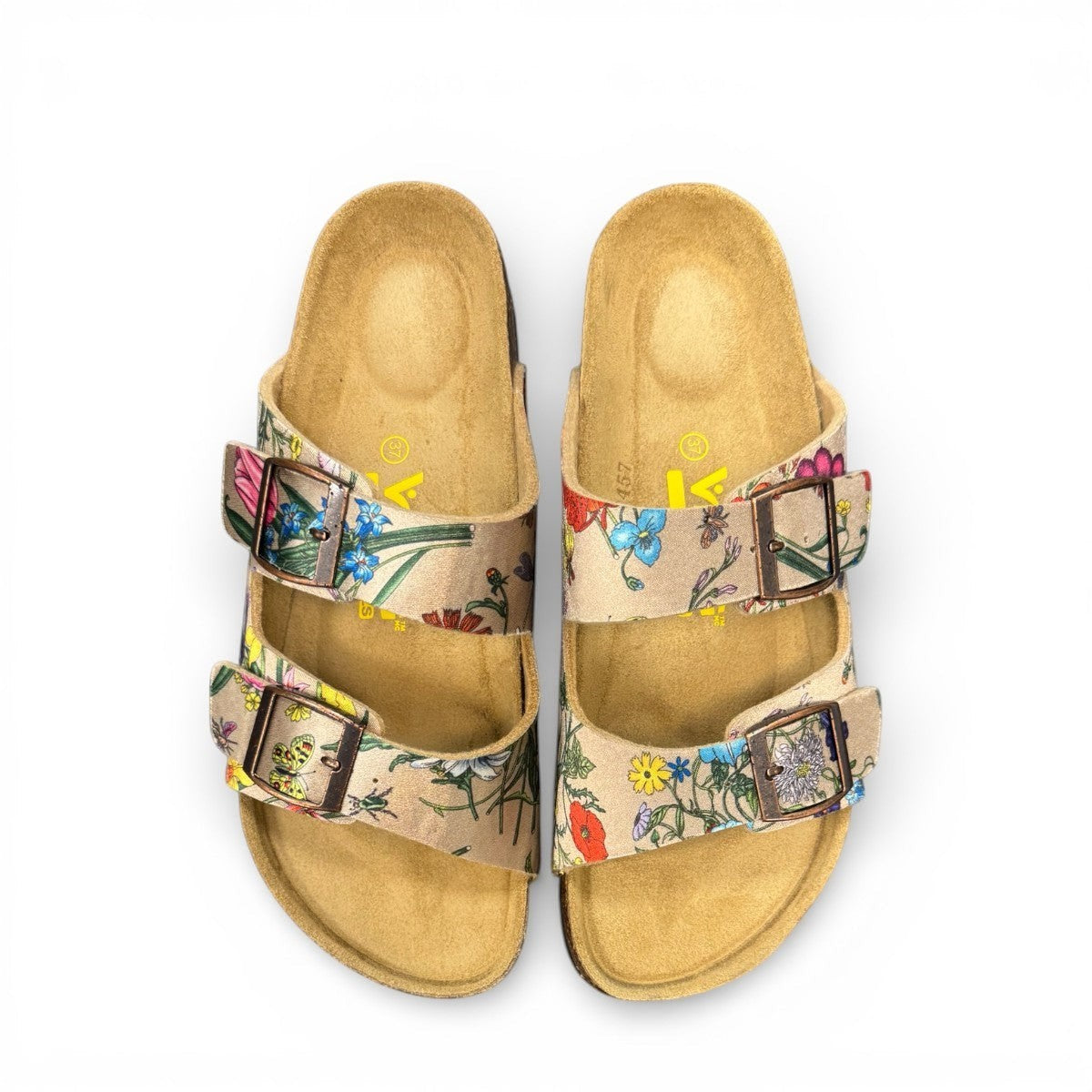 Viking Chatham toe-loop sandal with a beige floral wild garden print, cork midsole, and adjustable buckles.
photo of the top side