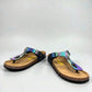 Viking Laguna glitzy rainbow thong sandal with a cork footbed and adjustable buckle strap.
photo of the front side