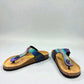 Viking Laguna glitzy rainbow thong sandal with a cork footbed and adjustable buckle strap.
photo of the front side