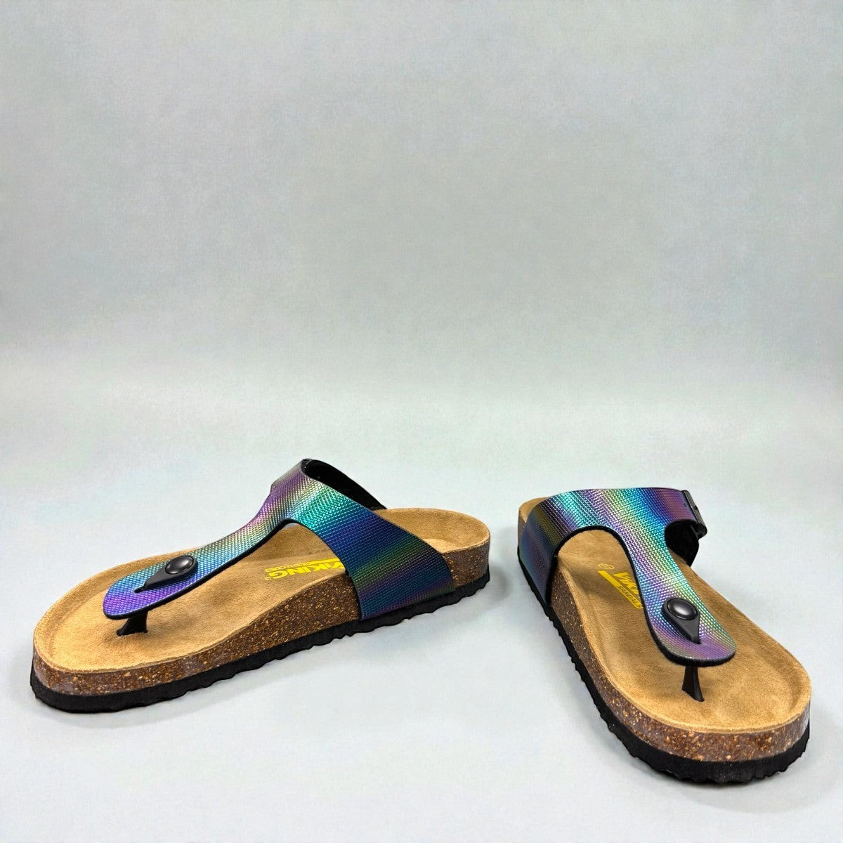 Viking Laguna glitzy rainbow thong sandal with a cork footbed and adjustable buckle strap.
photo of the front side