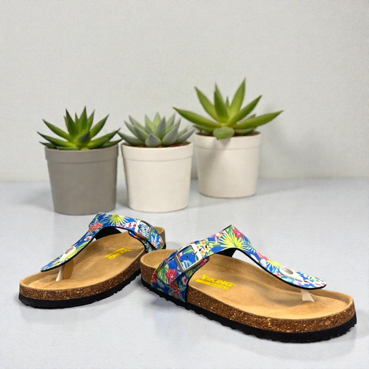 Viking Laguna thong sandals with blue tropical butterfly print strap and adjustable buckle on cork sole.
photo of the front side