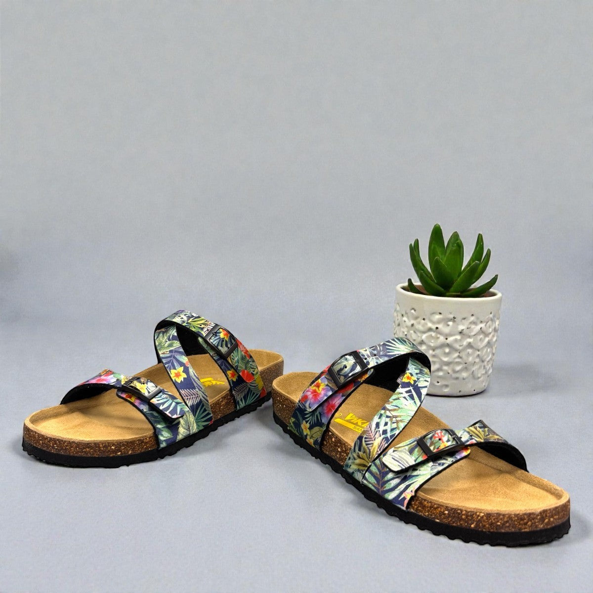 VIKING SYDNEY slide sandals with tropical floral print straps, adjustable buckles, and cork footbed.
photo of the front side