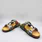 VIKING SYDNEY slide sandals with tropical floral print straps, adjustable buckles, and cork footbed.
photo of the front side