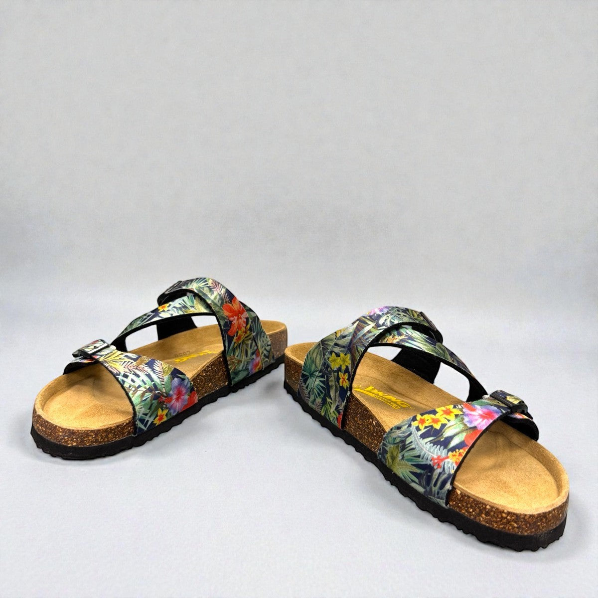 VIKING SYDNEY slide sandals with tropical floral print straps, adjustable buckles, and cork footbed.
photo of the front side