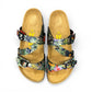 VIKING SYDNEY slide sandals with tropical floral print straps, adjustable buckles, and cork footbed.
photo of the top side