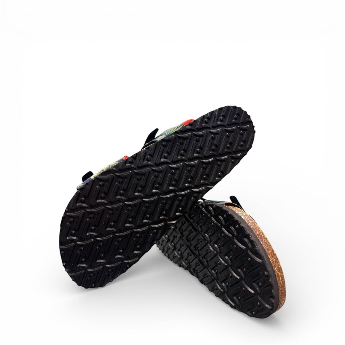 VIKING SYDNEY slide sandals with tropical floral print straps, adjustable buckles, and cork footbed.
photo of the bottom side