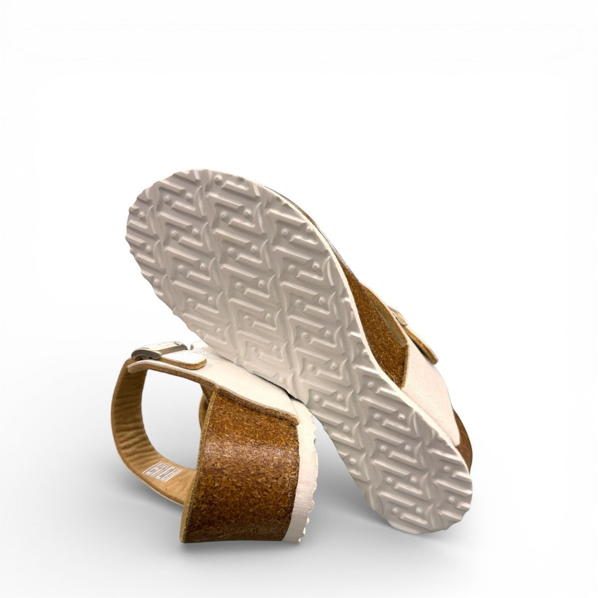 Viking Tampa white leather wedge sandals with a cork sole and adjustable buckle strap.
photo of the bottom side