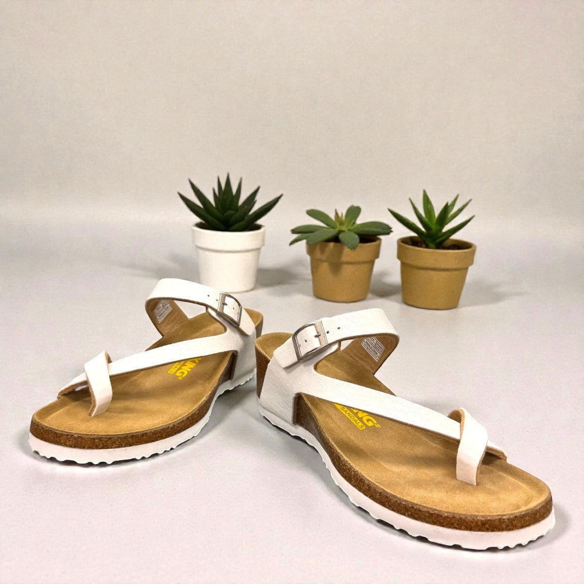 Viking Tampa white leather wedge sandals with a cork sole and adjustable buckle strap.
photo of the front side