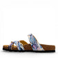 Viking Chatham toe-loop sandal with a beige floral wild garden print, cork midsole, and adjustable buckles.
photo of the left side