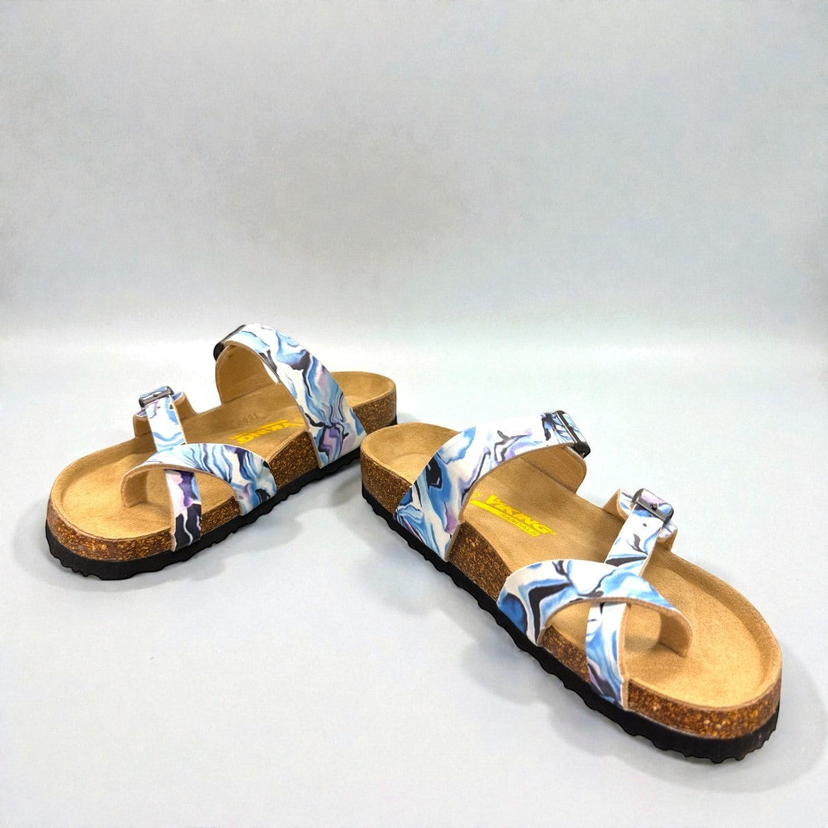 Viking Chatham toe-loop sandal with a beige floral wild garden print, cork midsole, and adjustable buckles.
photo of the front side