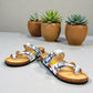 Viking Chatham toe-loop sandal with a beige floral wild garden print, cork midsole, and adjustable buckles.
photo of the front side