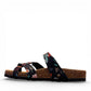Viking Banff three-strap sandal in black paisley print with cork midsole and adjustable buckles.
photo of the left side