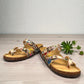 VIKING TOFINO toe-loop sandal in Wild Garden floral print with adjustable buckles and cork footbed.
photo of the front side