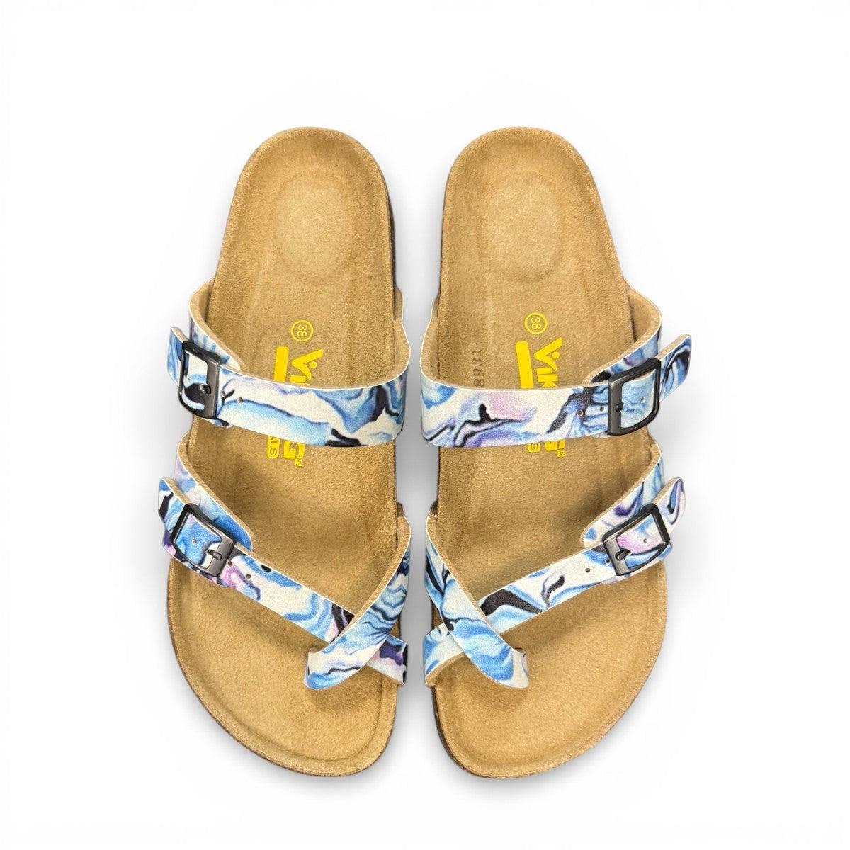 Viking Chatham toe-loop sandal with a beige floral wild garden print, cork midsole, and adjustable buckles.
photo of the top side
