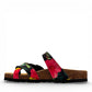 Vikings Tofino toe-loop sandals in black hibiscus floral print with adjustable buckles and cork midsole.
photo of the left side