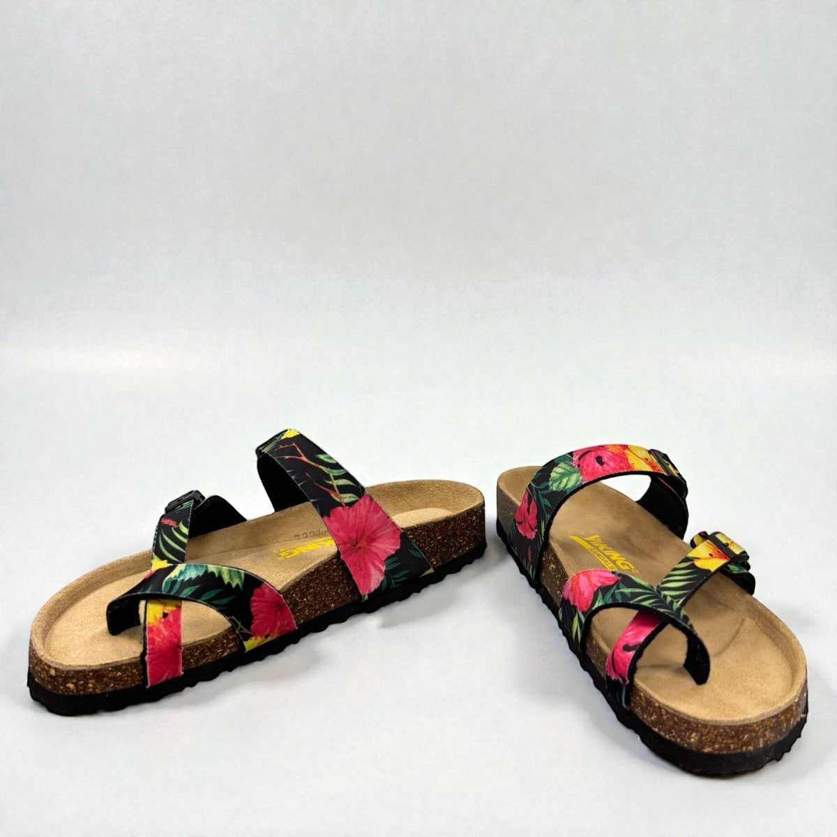 Vikings Tofino toe-loop sandals in black hibiscus floral print with adjustable buckles and cork midsole.
photo of the front side