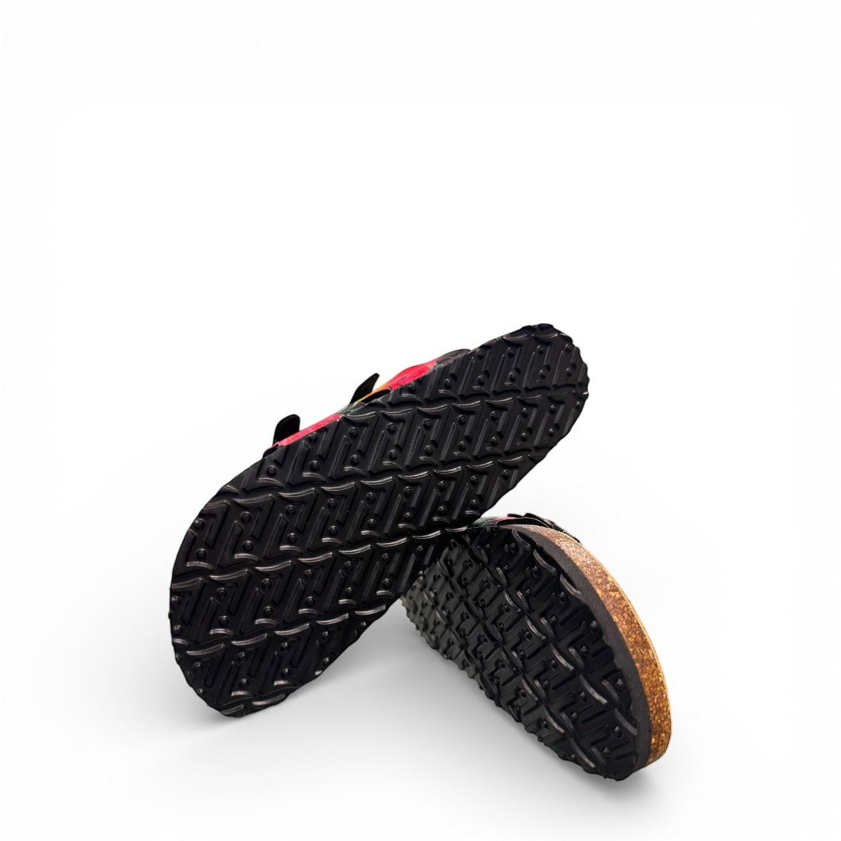 Vikings Tofino toe-loop sandals in black hibiscus floral print with adjustable buckles and cork midsole.
photo of the bottom side