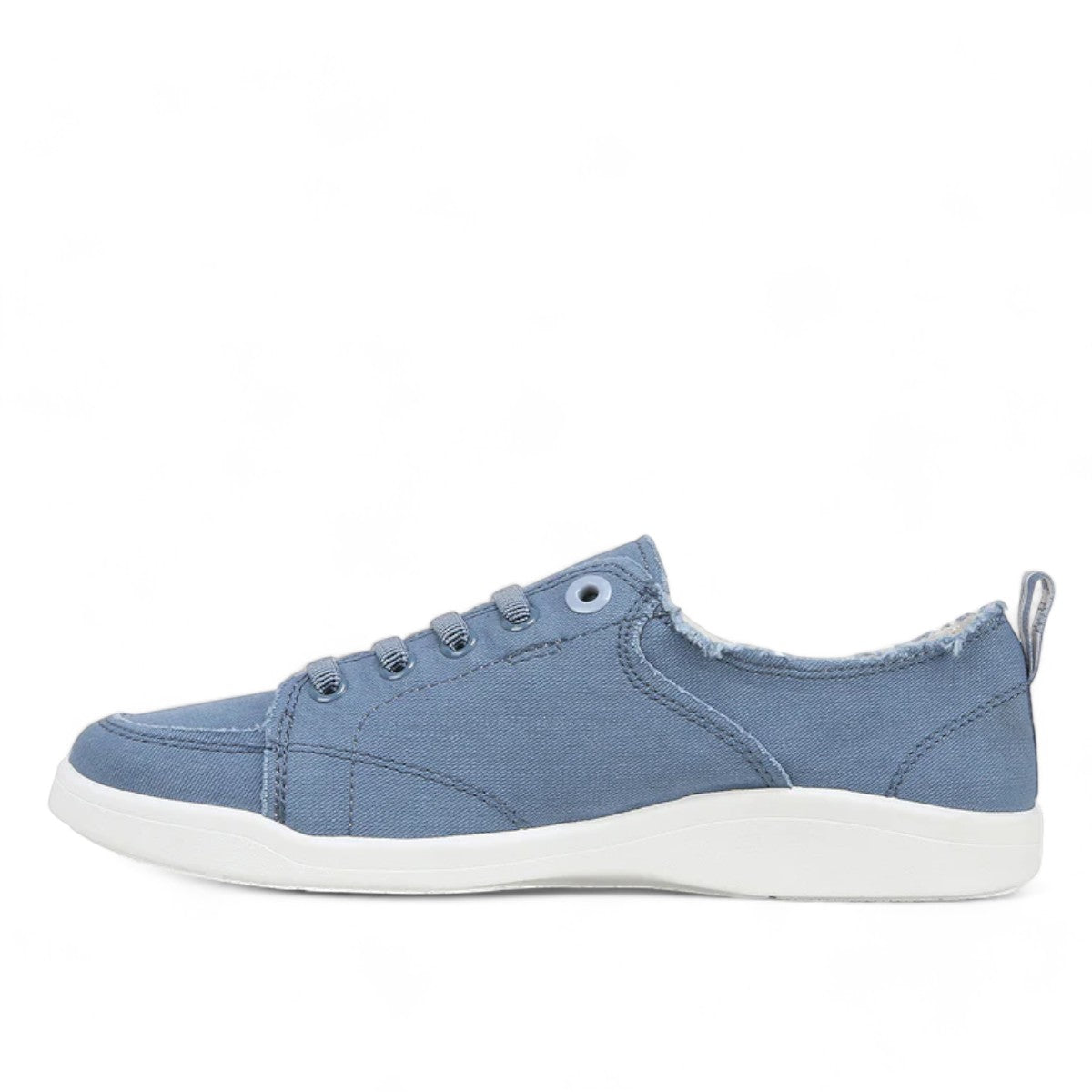 Vionic Venice Pismo skyway blue cotton canvas slip-on sneaker with frayed edges and white TPR outsole.
photo of the left side