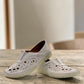 wonder-metadata-S5552 white leather slip-on shoe with intricate laser-cut patterns and a flexible cushioned sole.
photo of the front side
